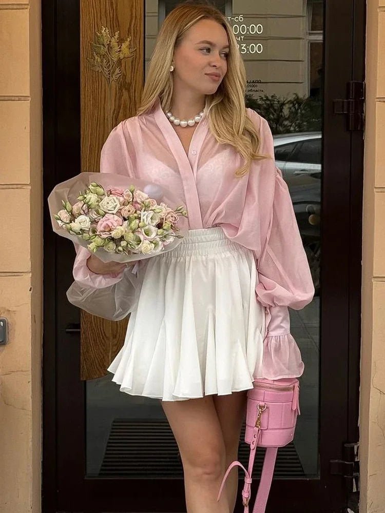 Brielle genomskinlig blus med knappar