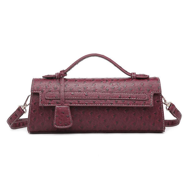 Jasmin clutch med präglat mönster