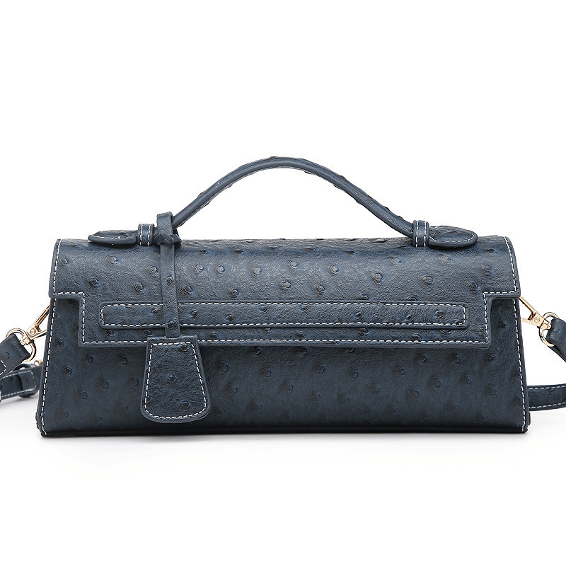 Jasmin clutch med präglat mönster