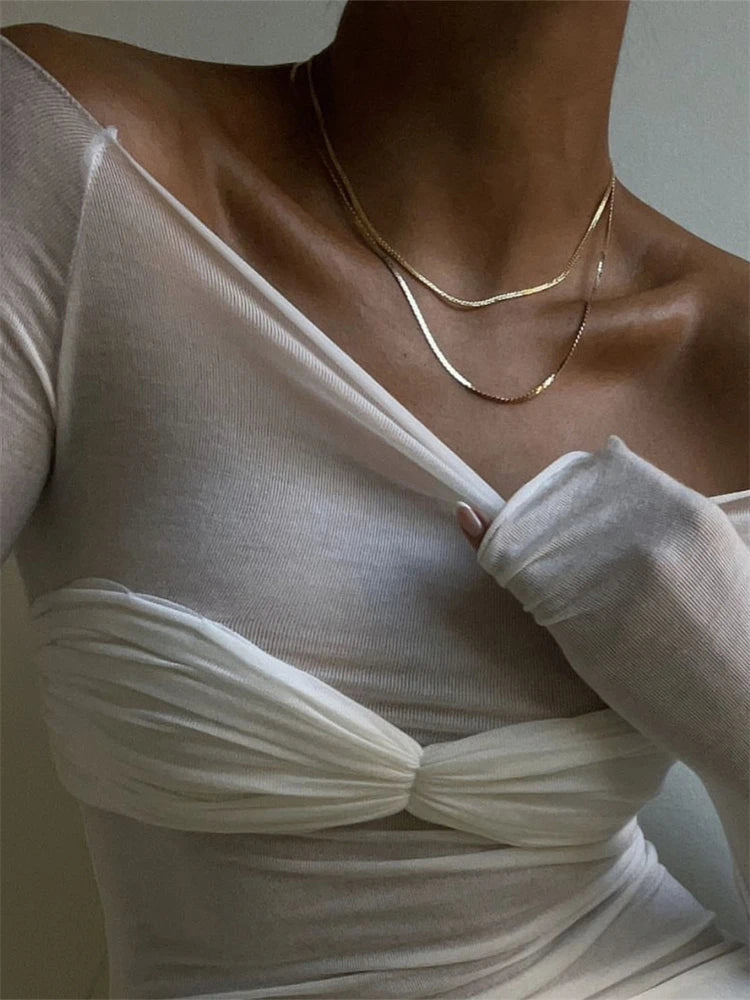 Sara genomskinlig mesh-topp med bara axlar