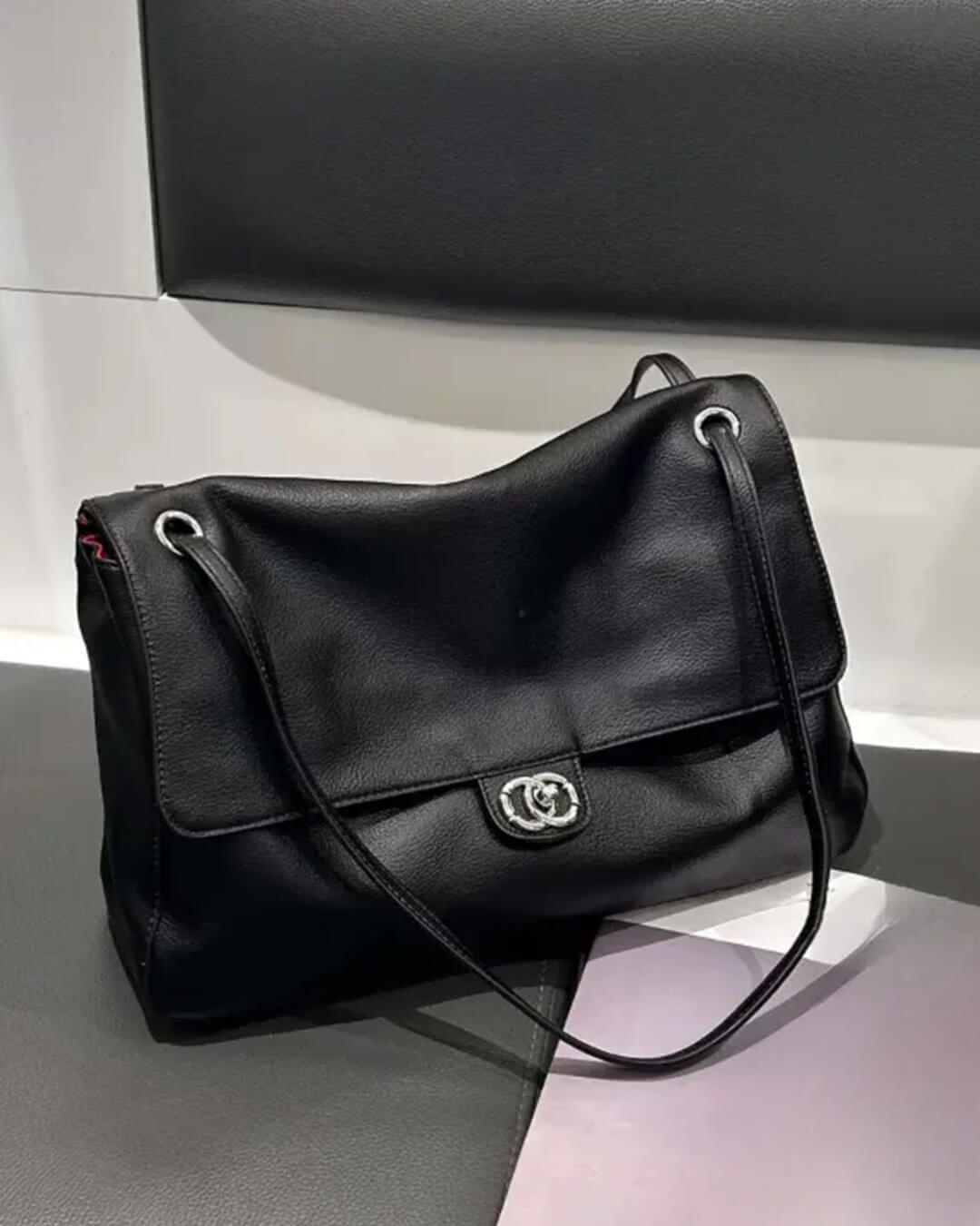 Solveig Buckle Flap Shoulder Bag in black – styled look